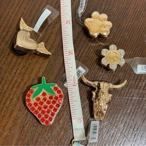 CROCS JIBBITZ 5 piece set of gold metallic tone jibbitz each retailing $6.99